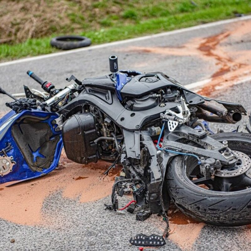 blue-motorcycle-crashed-on-the-road